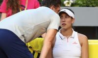 French Open champion Muguruza retires injured in Rome