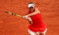 French Open PHOTOS: Wozniacki survives scare, Muguruza advances