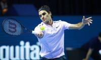 Razor-sharp Federer races through in Basel