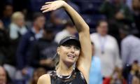 Sharapova back in business on and off court