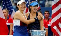 Hingis wins second Slam in two days!