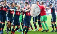 Football Briefs: Bayern overcome bizarre own goal to clinch another title