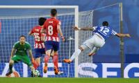 Football briefs: Barca sniff title after Atletico lose