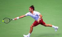 US Open PIX: Federer, Djokovic advance; Wozniacki crashes out