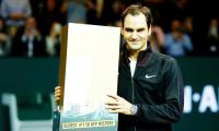 Back on top, Federer becomes oldest ATP world number one