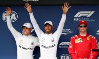 F1: Hamilton beats the elements to seize pole in wet Hungary