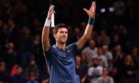 Djokovic marks return to world number one with easy win