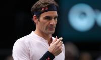 Federer begins road to 100 with a win in Paris