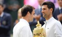 Djokovic returns to Wimbledon with eye on record