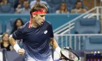 Ferrer stuns Zverev, Federer fights back; Osaka out