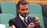 Beckham gets six-month driving ban for using phone