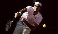 Federer survives match points to beat Monfils