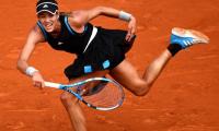 French Open PIX: Muguruza advances; Pliskova shocked