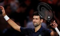 Impressive Djokovic beats Dimitrov as Nadal pulls out