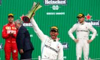 Hamilton wins in Mexico but must wait for sixth title