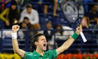 Djokovic stages great escape to enter Dubai final