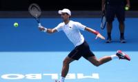 Djokovic crosses fingers for clean air in Melbourne