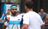 Indians at Aus Open: Divij advances, Bopanna ousted