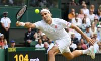 Federer roars into Wimbledon 4th round for 18th time