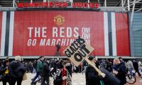 Man United-Liverpool tie postponed as fans storm pitch