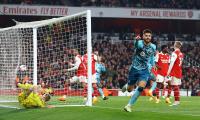 PICS: Arsenal stage late escape, but title hopes hit