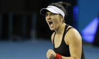 Andreescu battles to comeback win over Muguruza