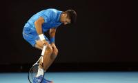 Hamstrung Djokovic taking it one day at a time