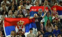 Djokovic's dad seen with fans carrying Russia flags