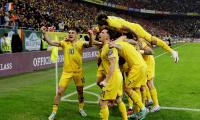 Euro qualifiers: Romania clinch top spot; France held