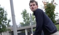 What is Carlsen doing on a bike at Chess Olympiad?