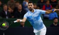 Djokovic dominates Monfils, eyes 100th trophy