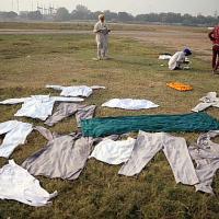 Farmers dry their clothes at the Nirankari ground in Delhi