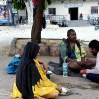 A family eats at a night shelter for homeless in New Delhi