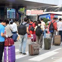 Passengers wait their turn at Patna airport
