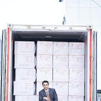 SII CEO Adar Poonawala poses with the first shipment of Covishield vaccine