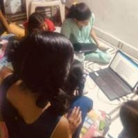 Slum children learn computer skills at the Vacha Charitable Trust
