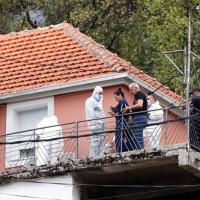 Forensic team at the house where a gunman started a mass shooting in Cetinje, Montenegro, August 12,/Reuters 2022.