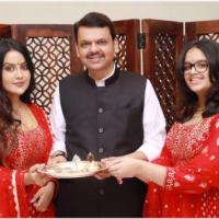 Amruta with her husband Devendra Fadnavis and their daughter