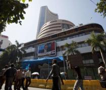 Markets flat in noon deals; banks, auto drag