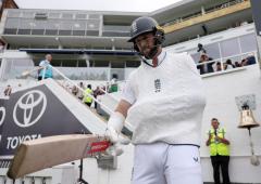 PIX: Hand in Sling, Brave Woakes Walks Out to Bat 