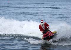 Santa Arrives On A Jet Ski!