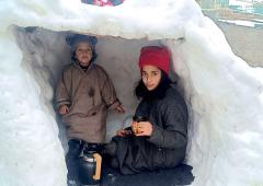 Enjoying Hot Tea In A Frozen Igloo