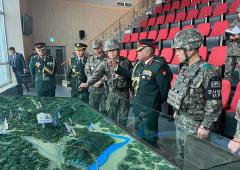 Army Chief In South Korea; Kim Celebrates In North