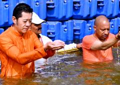 Bhutan's King Takes Dip In Sangam