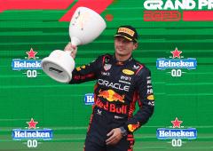 Record-equalling Verstappen bags rain-soaked win