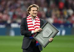 World Cup star Forlan takes up tennis racket