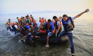 PIX: Fleeing war and repression, refugees flood Greece island