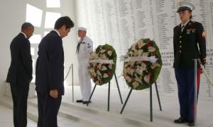 Wreaths and hugs: Japan's Abe offers sombre tribute at Pearl Harbor
