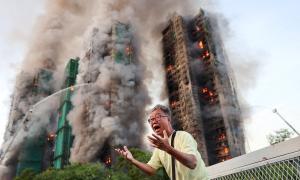 55 dead in Hong Kong high-rise fire; 279 still missing
