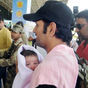PHOTOS: Dhoni checks in for IPL with daughter Ziva in tow